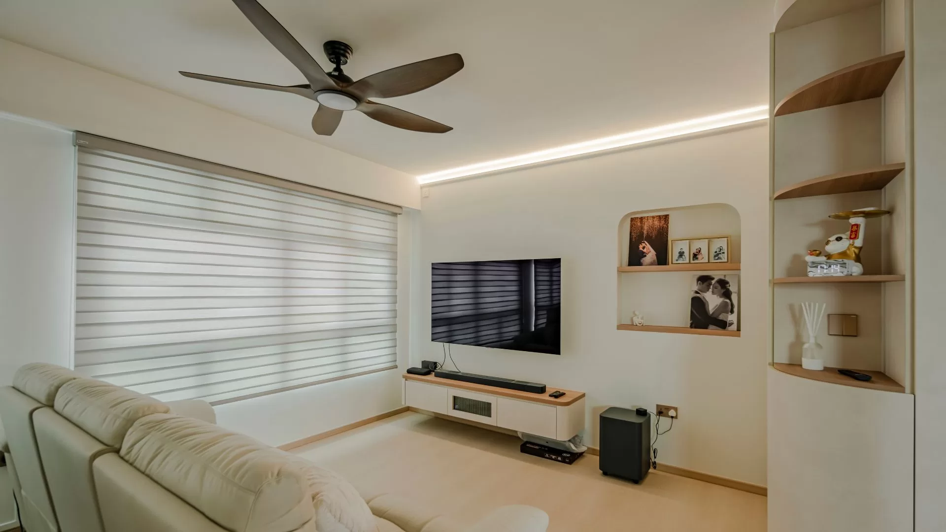 Modern Singapore HDB living room with cove lighting creating spacious ambiance.