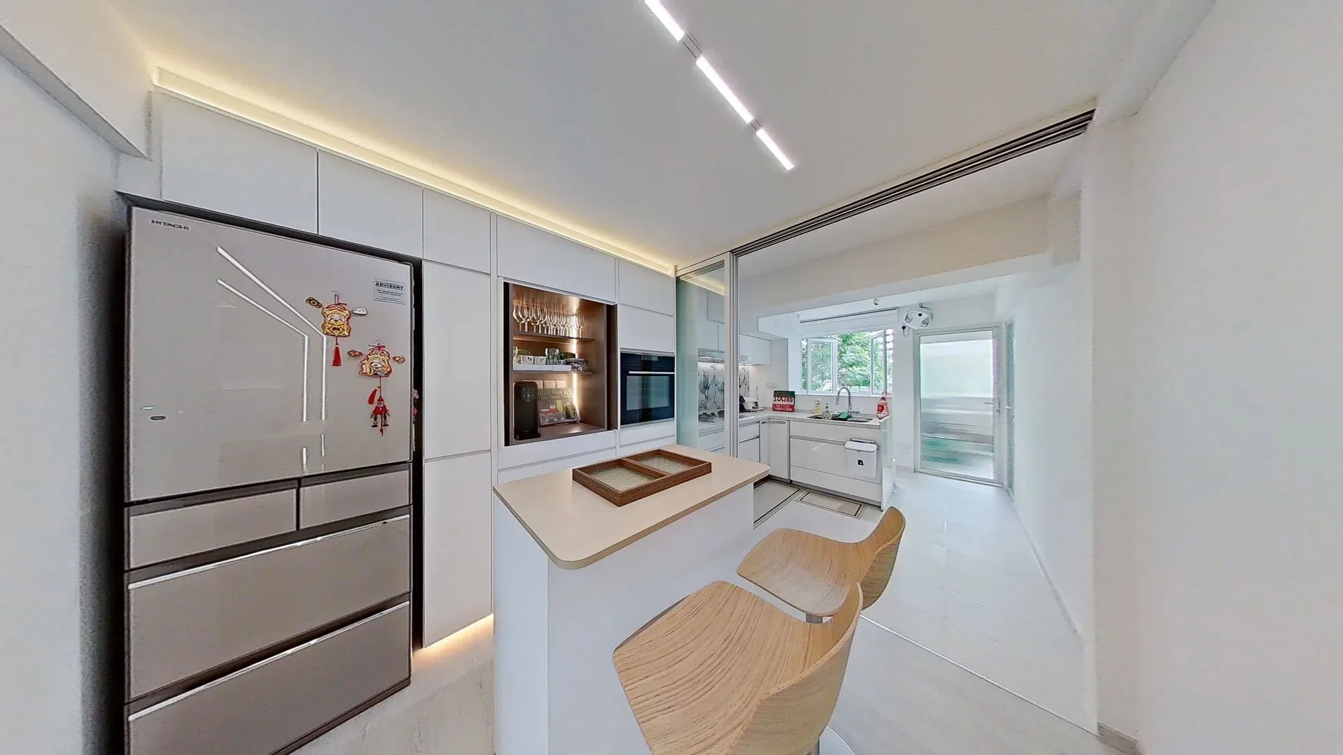 Seamless architectural lighting using the HAGA system to enhance a clean kitchen design, creating a bright and airy atmosphere